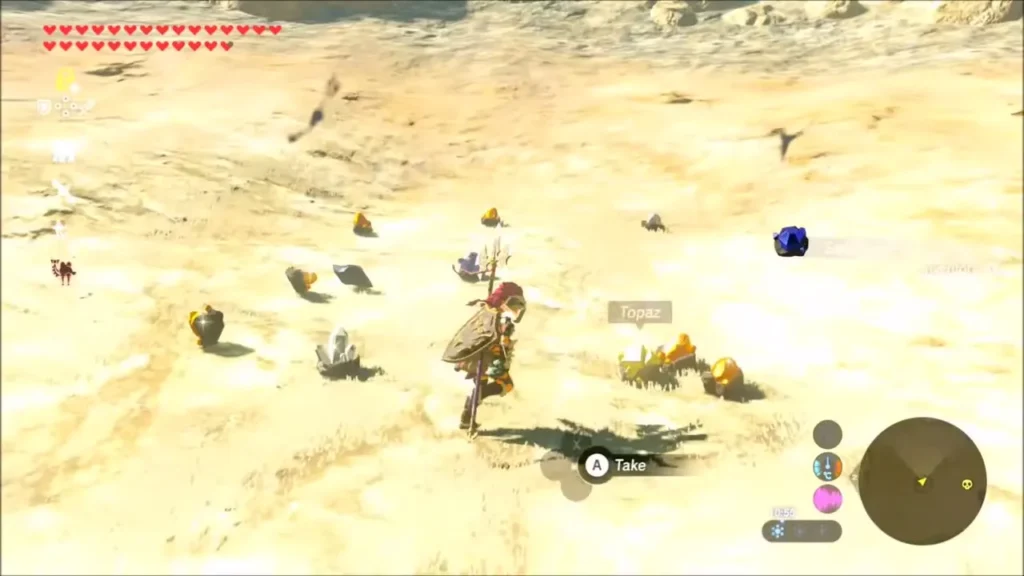 Gems and ore scattered across the sand after the Talus falls Gems and ore scattered across the sand after the Talus falls