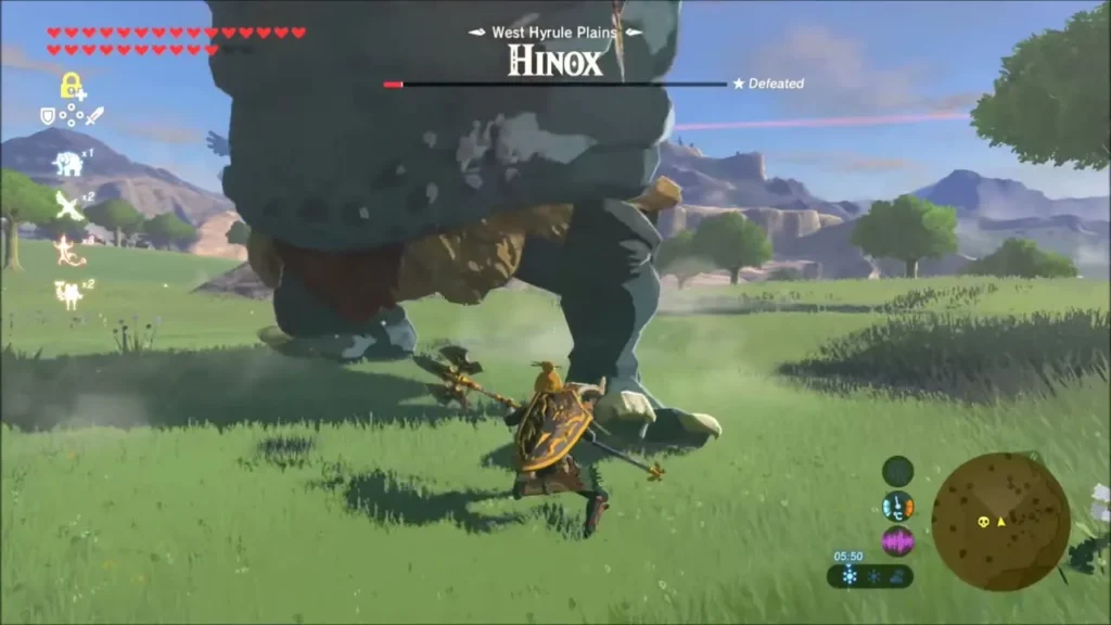 Link running under a nearly defeated Hinox on the plains Link running under a nearly defeated Hinox on the plains