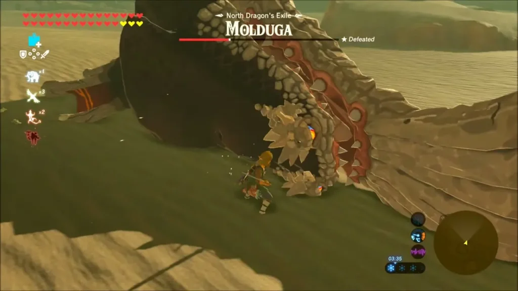 Link striking the open mouth of the Molduga on the sand near Dragon's Exile Link striking the open mouth of the Molduga on the sand near Dragon's Exile