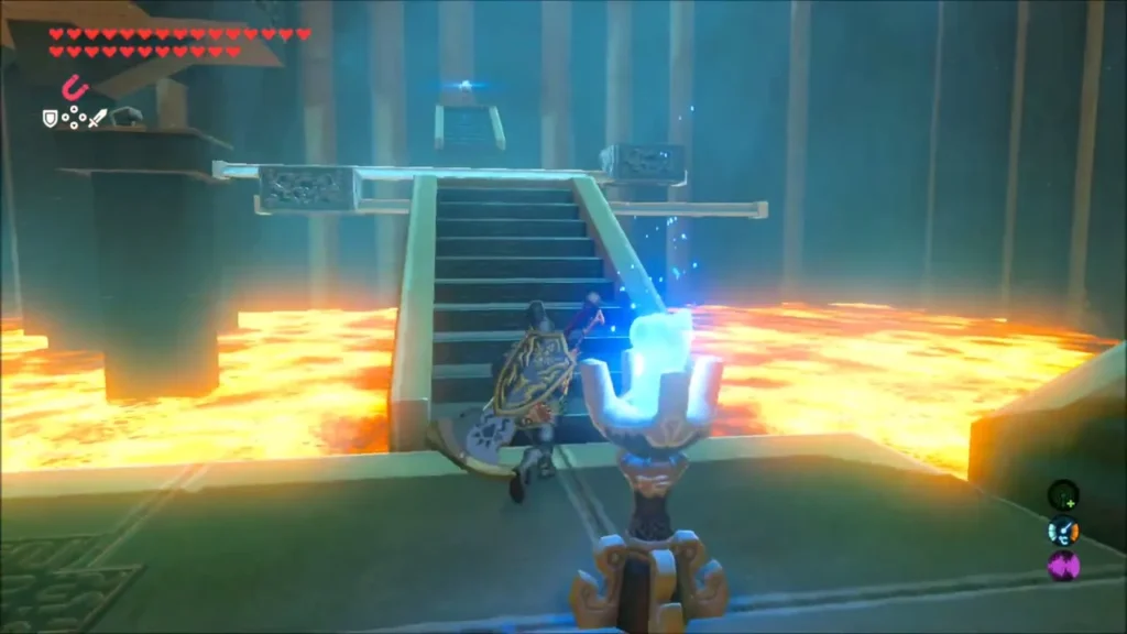 Link beside a blue flame torch with lava around the stairs in Shora Hah Shrine Link beside a blue flame torch with lava around the stairs in Shora Hah Shrine