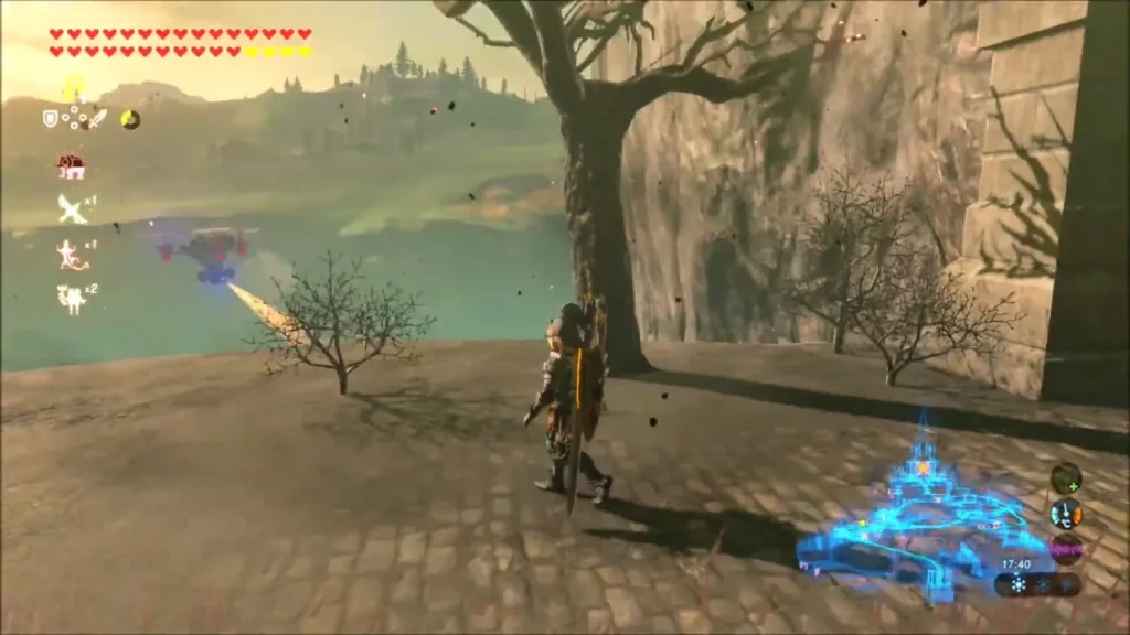 Link standing on the high stone ledge outside the castle with the lake below Link standing on the high stone ledge outside the castle with the lake below