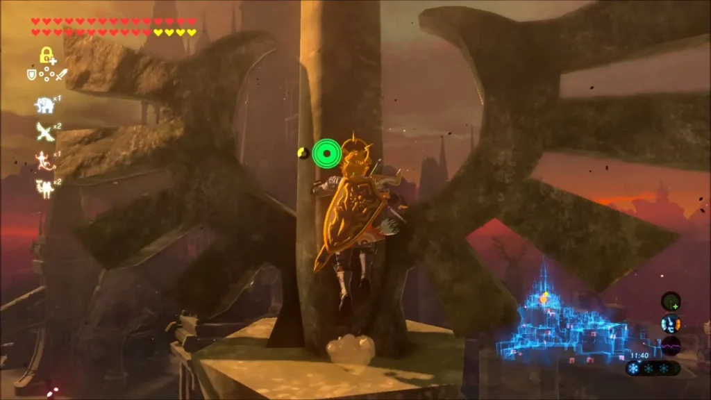 Link on the pole near the top, below the large tower fins Link on the pole near the top, below the large tower fins