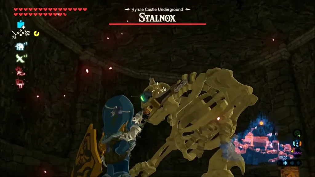 Link aiming an arrow at the eye of the Stalnox in the bone-strewn room Link aiming an arrow at the eye of the Stalnox in the bone-strewn room