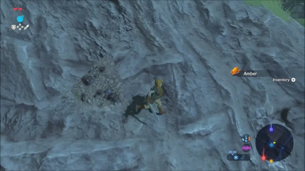 Link mining a dark ore deposit in a rock face and collecting an Amber Link mining a dark ore deposit in a rock face and collecting an Amber