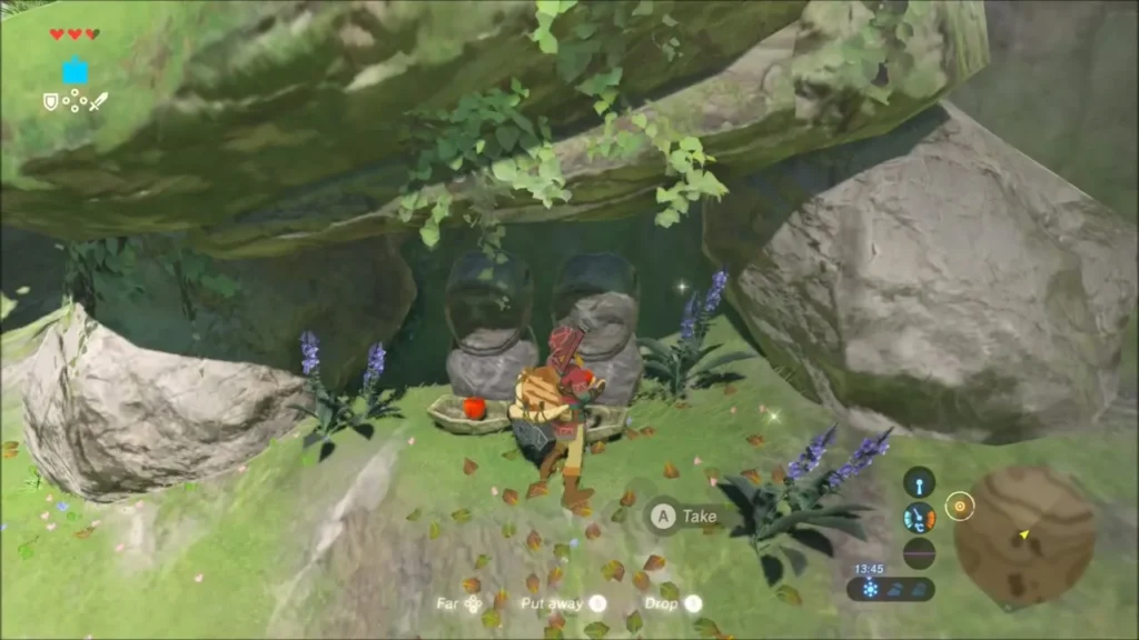 Link kneeling at two stone statues under a rock overhang holding an apple bowl Link kneeling at two stone statues under a rock overhang holding an apple bowl
