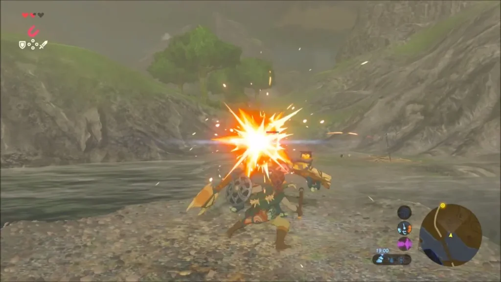 Link striking a Bokoblin on the river bank with sparks flying Link striking a Bokoblin on the river bank with sparks flying