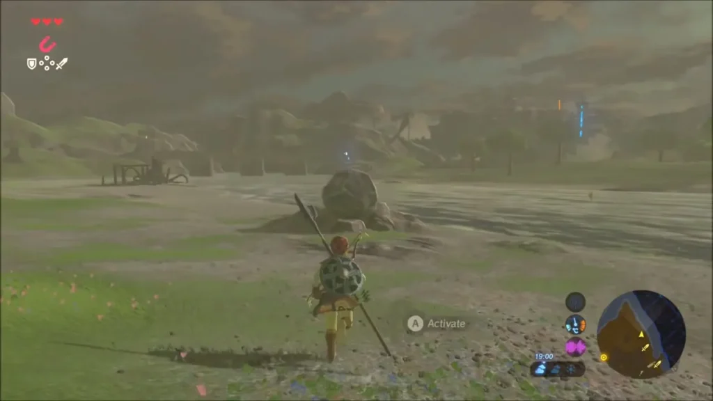 Link running toward a big grey boulder sitting on a mound on the plain Link running toward a big grey boulder sitting on a mound on the plain