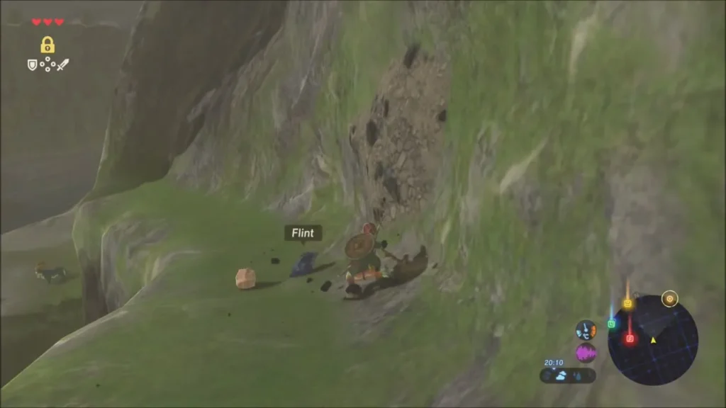 Link mining a rock for Flint on the steep slope Link mining a rock for Flint on the steep slope