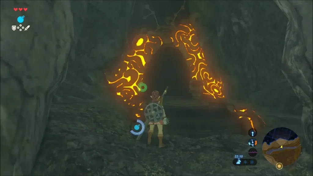 Link facing the glowing orange shrine entrance in the cave Link facing the glowing orange shrine entrance in the cave