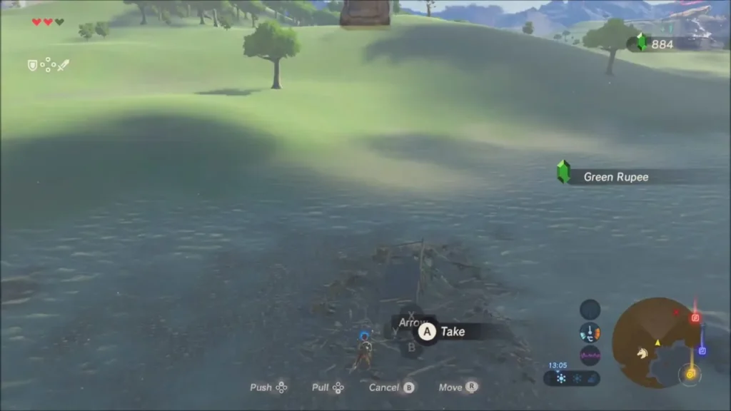 Link in the shallows pulling metal debris where a Green Rupee is hidden Link in the shallows pulling metal debris where a Green Rupee is hidden
