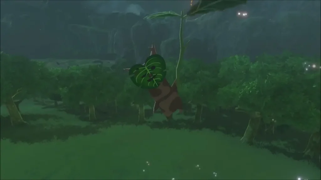 A Korok hanging from a leaf above the forest on the hillside A Korok hanging from a leaf above the forest on the hillside