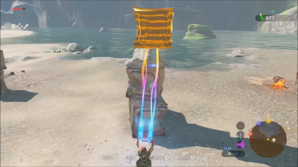 Link using Magnesis to lift a metal crate beside the water near the camp Link using Magnesis to lift a metal crate beside the water near the camp
