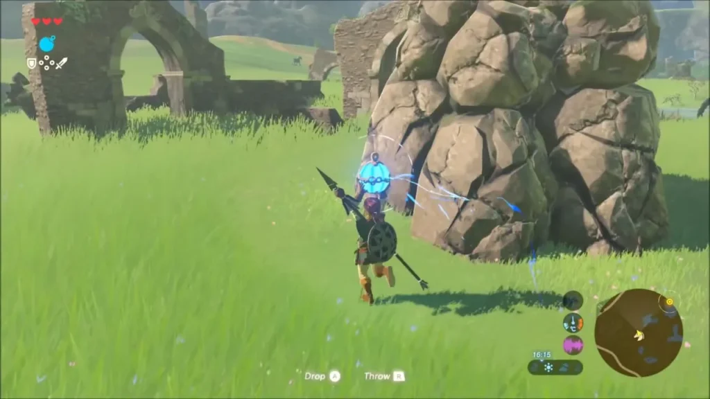 Link placing a remote bomb against a pile of boulders beside a ruined arch Link placing a remote bomb against a pile of boulders beside a ruined arch