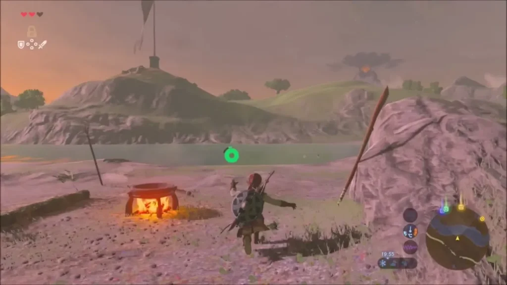 Link beside the cook fire of the second Bokoblin camp on the riverbank Link beside the cook fire of the second Bokoblin camp on the riverbank