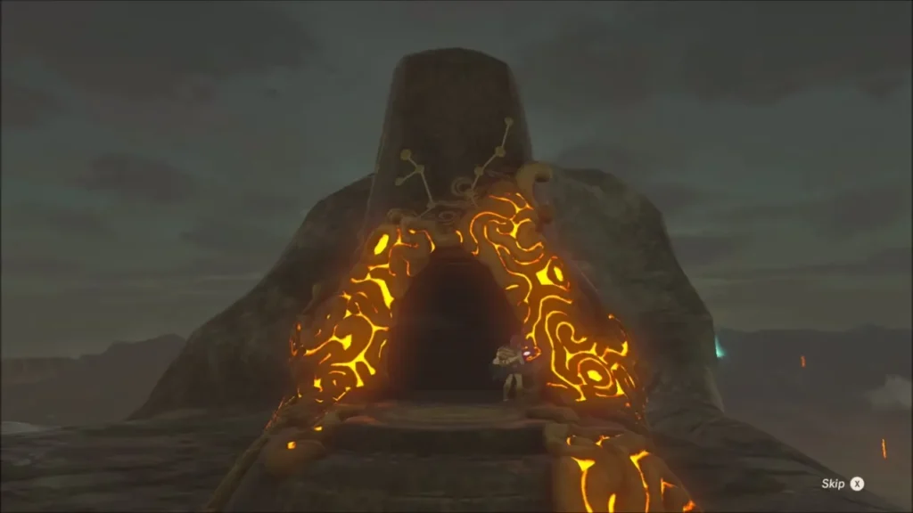 The glowing orange arch of Shee Vaneer Shrine on the summit with Link at its door The glowing orange arch of Shee Vaneer Shrine on the summit with Link at its door