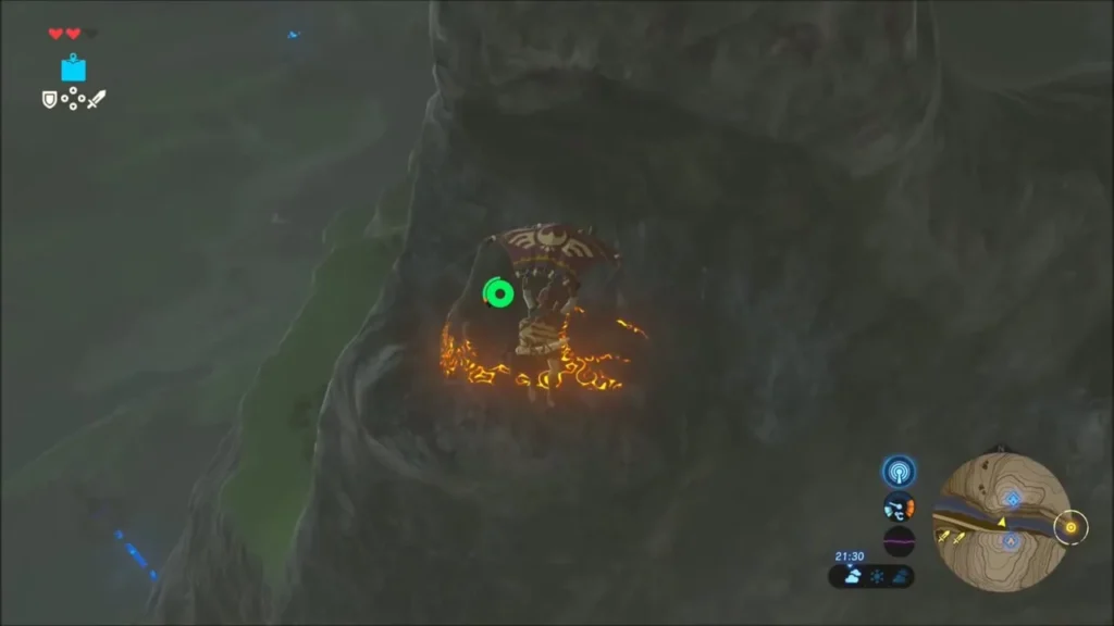Shee Venath Shrine glowing orange in the cliff face seen from above Shee Venath Shrine glowing orange in the cliff face seen from above