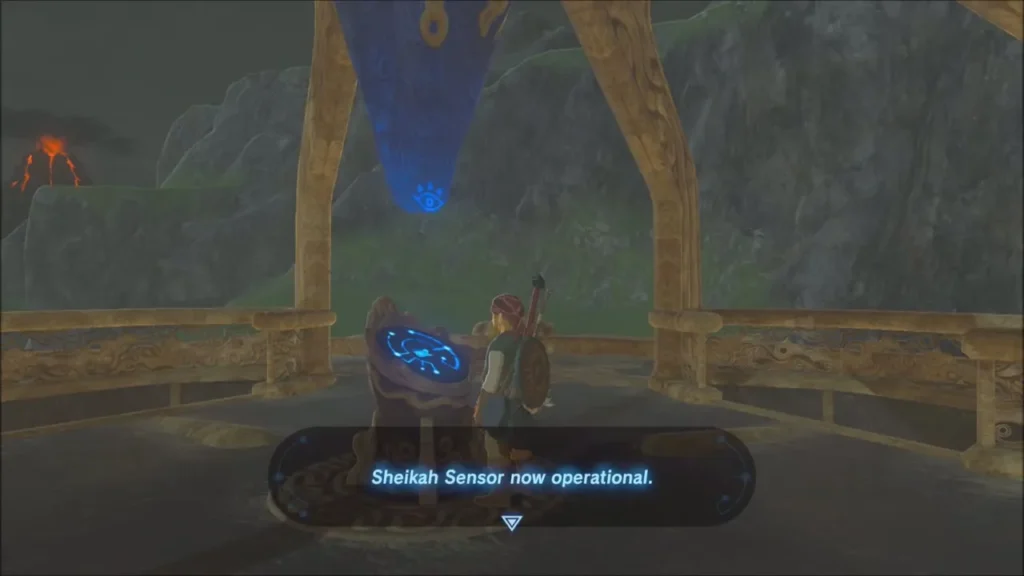 Link beside the tower terminal as the Sheikah Sensor becomes operational Link beside the tower terminal as the Sheikah Sensor becomes operational