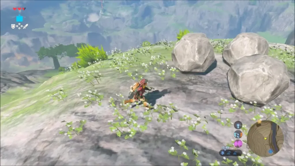 Link beside three loose boulders on a grassy hillside of the Dueling Peaks Link beside three loose boulders on a grassy hillside of the Dueling Peaks