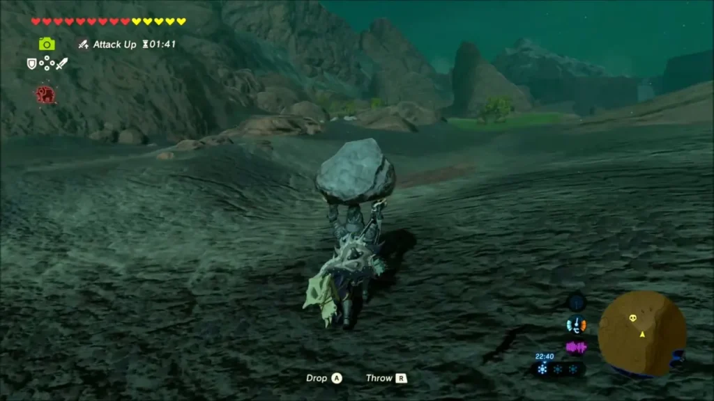 Link carrying a boulder across a dark rocky slope