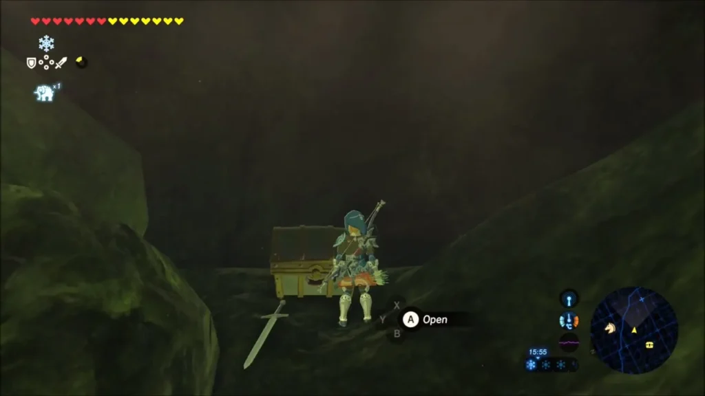 Link beside a closed chest in a dark cave on the lakeshore