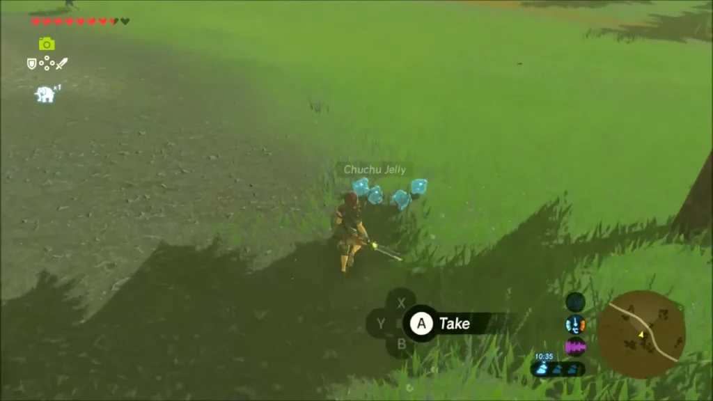 Link about to pick up Chuchu Jelly in the grass