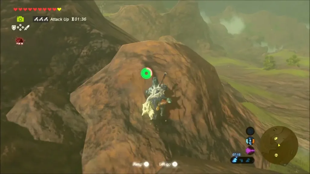 Link climbing the rust-coloured rock spire