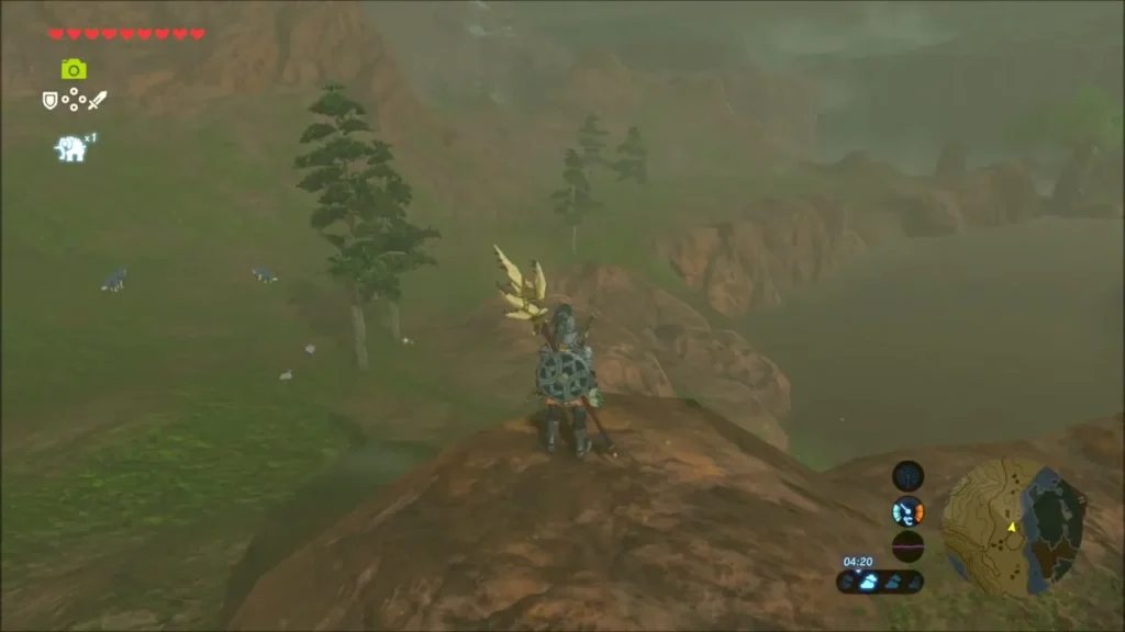 Link standing on a rocky rise above the misty grassland in north-west Hyrule