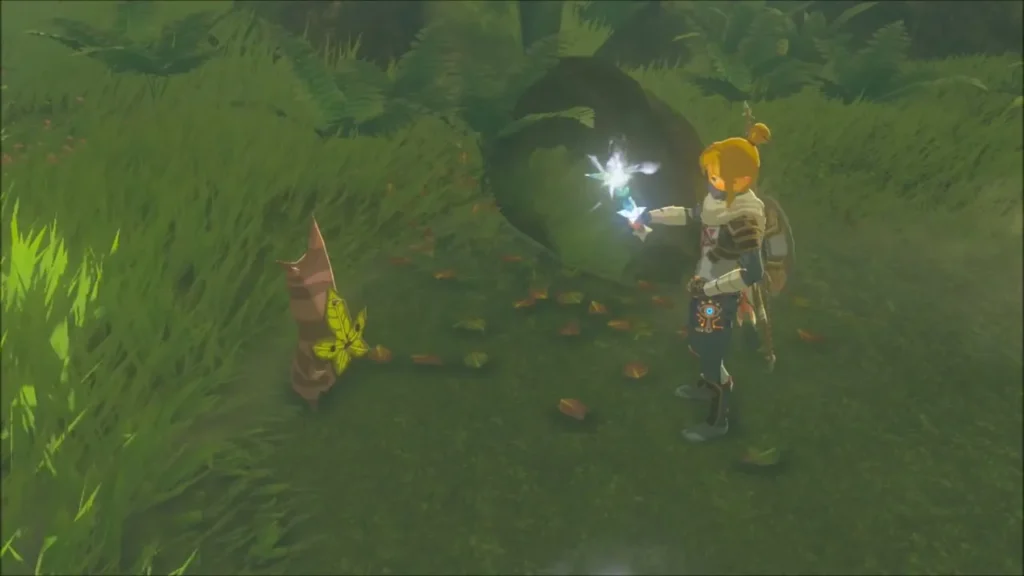 Link holding the Ice Rod out to Kula, the Korok beside a mossy log