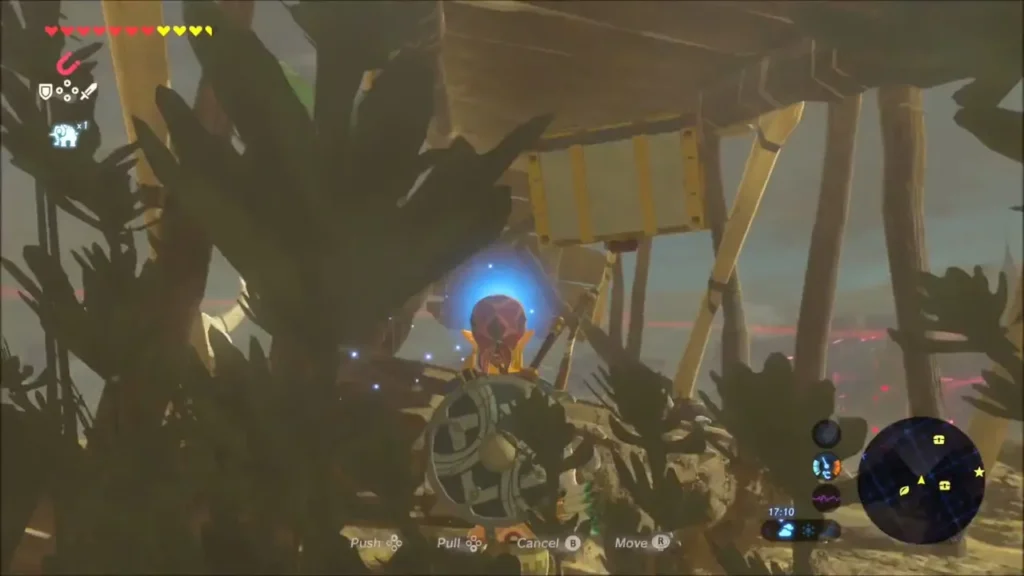 Link pulling a chest with Magnesis beneath a wooden scaffold
