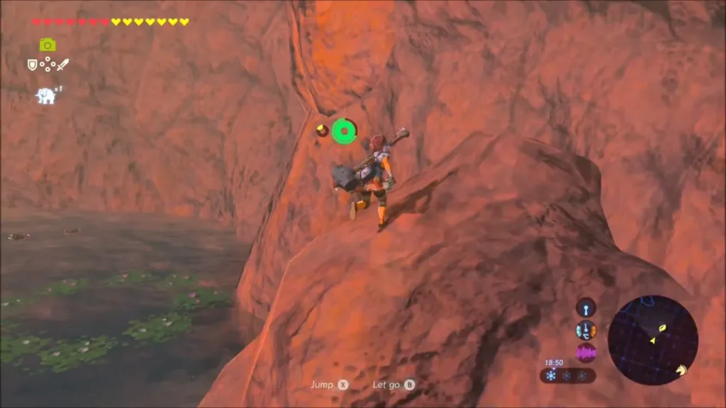 Link climbing the red rock cliff above Pico Pond
