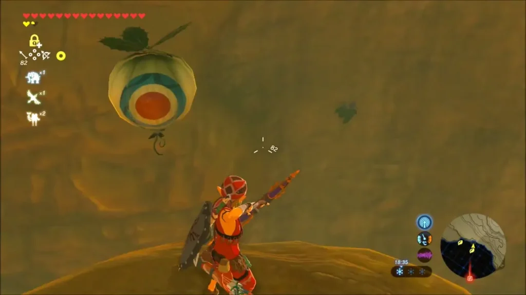 Link drawing his bow at a balloon target floating beside a cliff wall Link drawing his bow at a balloon target floating beside a cliff wall