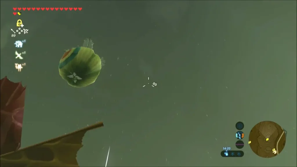 A target balloon floating in the rain with the bow reticle nearby A target balloon floating in the rain with the bow reticle nearby