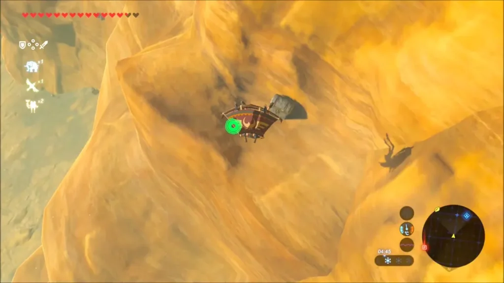 Chest pulled from the cliff face with Magnesis, hanging above the canyon Chest pulled from the cliff face with Magnesis, hanging above the canyon