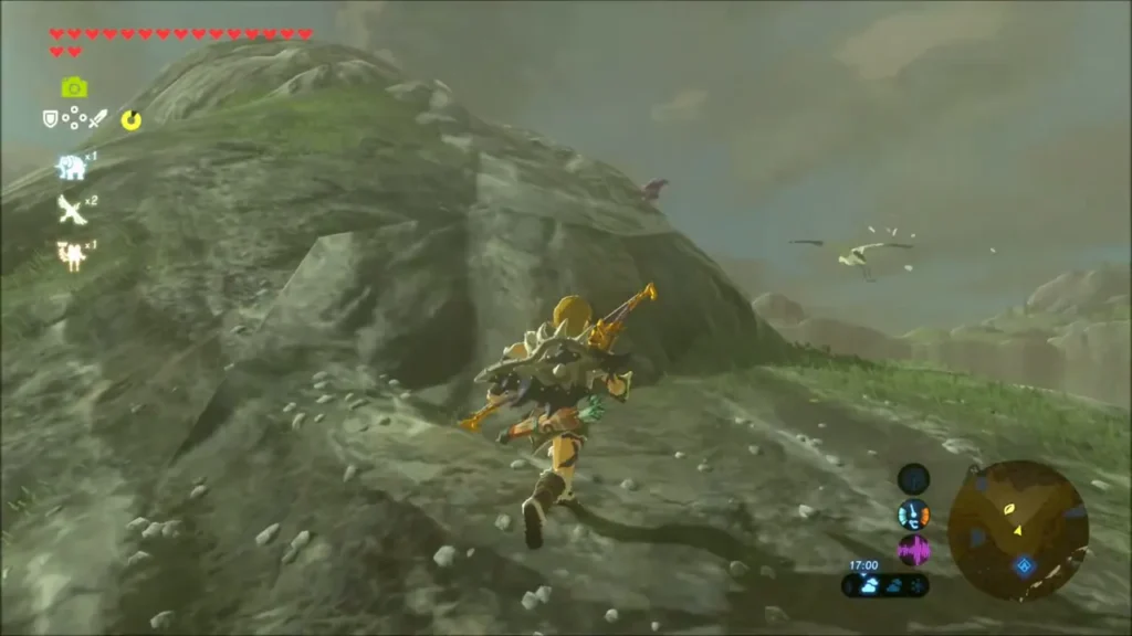 Link climbing a rocky hillside above the grassy slopes Link climbing a rocky hillside above the grassy slopes