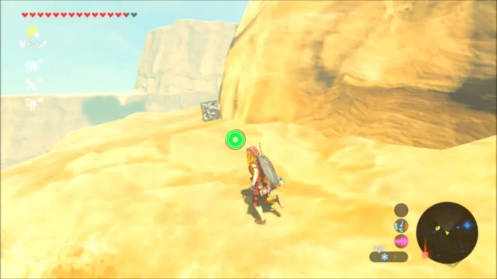 Link approaching a metal block sitting near the edge of a sandy cliff Link approaching a metal block sitting near the edge of a sandy cliff