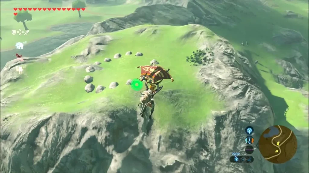 Ring of small stones with a gap on a grassy hilltop Ring of small stones with a gap on a grassy hilltop