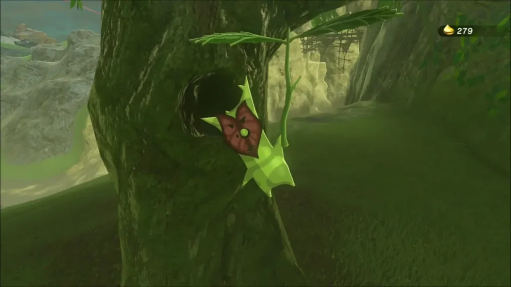 A Korok peeking from a tree hollow on a hillside A Korok peeking from a tree hollow on a hillside