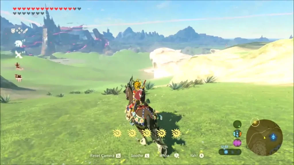 Link riding a horse across the green plain toward the canyon Link riding a horse across the green plain toward the canyon