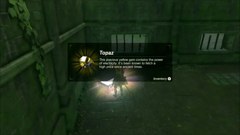 Link receiving a Topaz from the chest in the ruined hall Link receiving a Topaz from the chest in the ruined hall