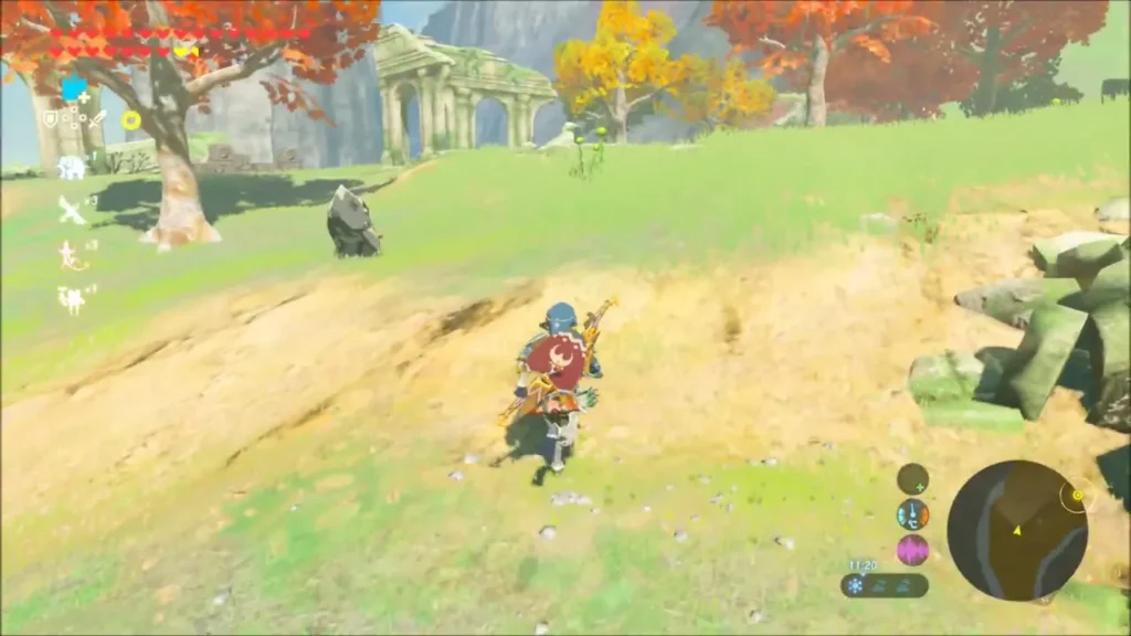 Link running through grassy ruins on the shore Link running through grassy ruins on the shore