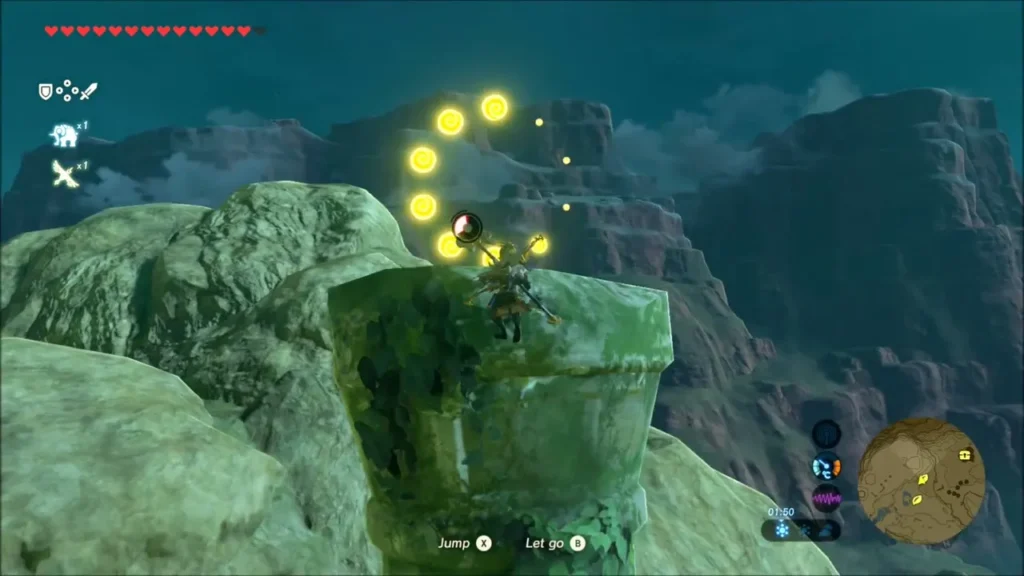 Link reaching the top of the column with a ring of golden dots above Link reaching the top of the column with a ring of golden dots above