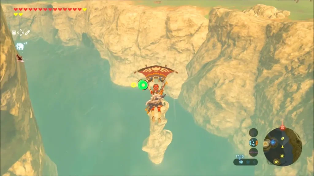 Link gliding over the water toward a thin rock spire Link gliding over the water toward a thin rock spire