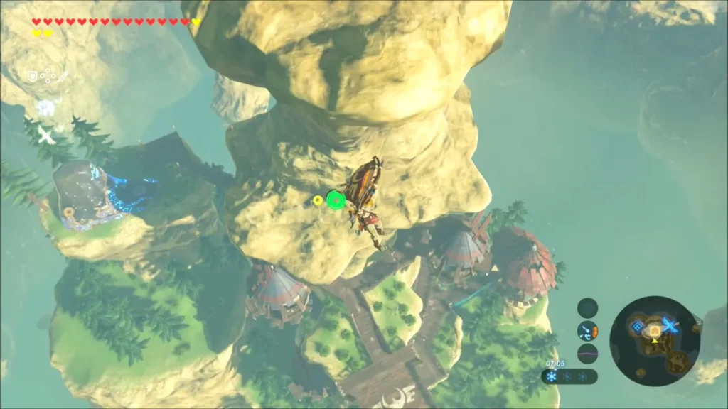 Link gliding past the tall rock pillar above Rito Village Link gliding past the tall rock pillar above Rito Village