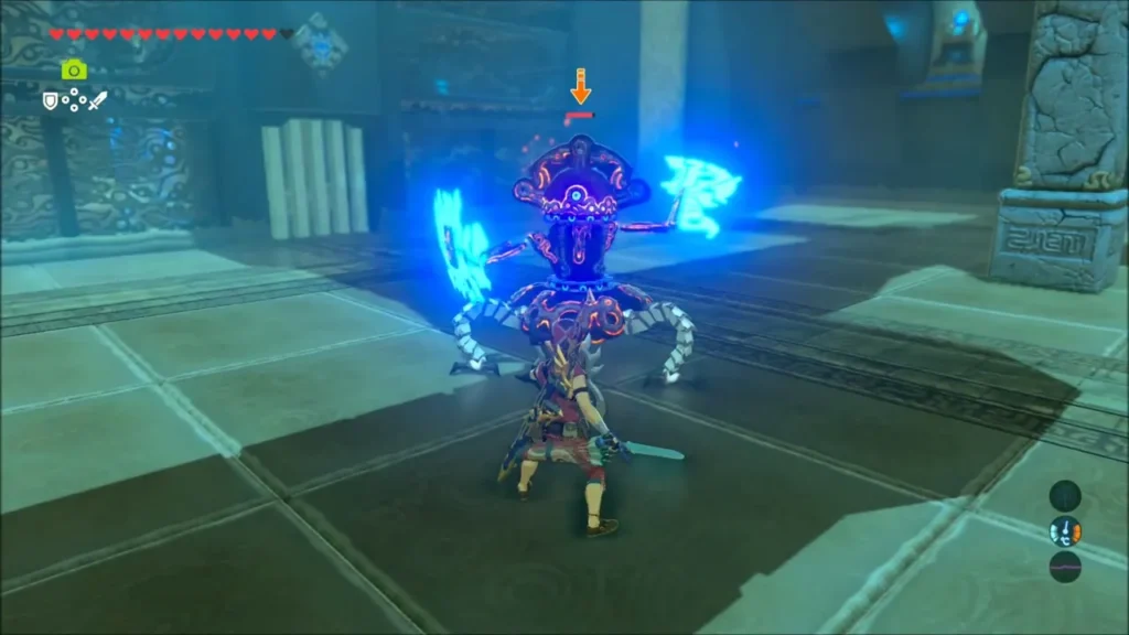 Link fighting the Guardian Scout IV as it raises its glowing blue blades Link fighting the Guardian Scout IV as it raises its glowing blue blades