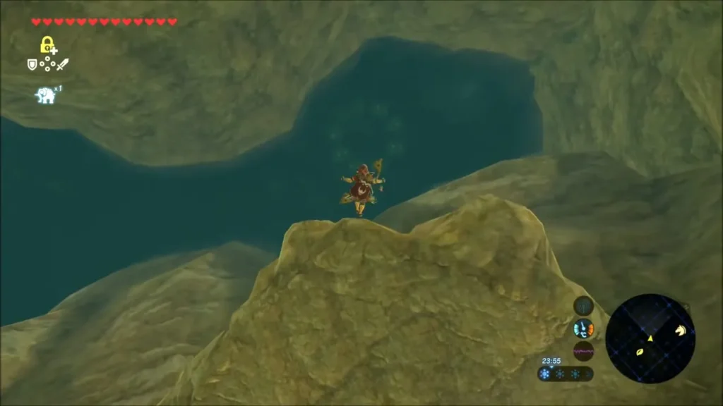 Link gliding along a rock wall above a cave pool Link gliding along a rock wall above a cave pool