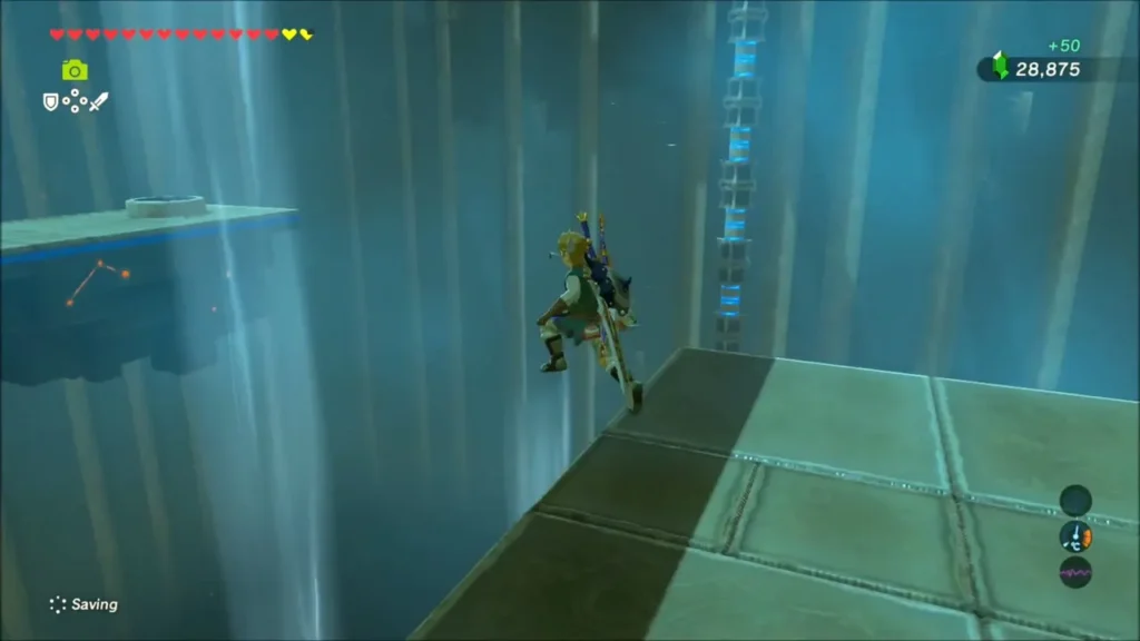 Link at a platform edge with a 50 rupee gain shown after the chest Link at a platform edge with a 50 rupee gain shown after the chest