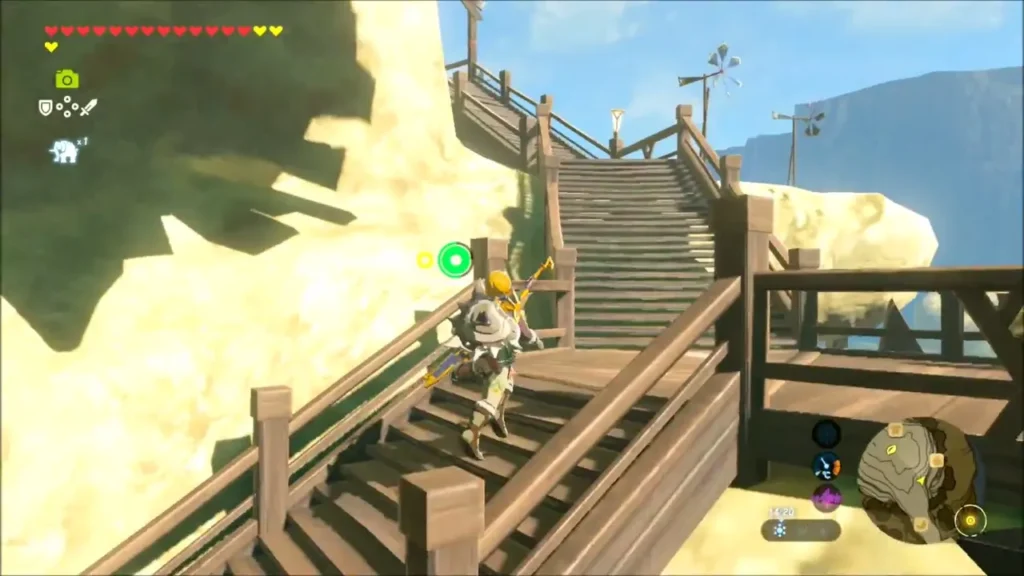 Link walking down wooden stairs on a sunlit cliff in Rito Village Link walking down wooden stairs on a sunlit cliff in Rito Village