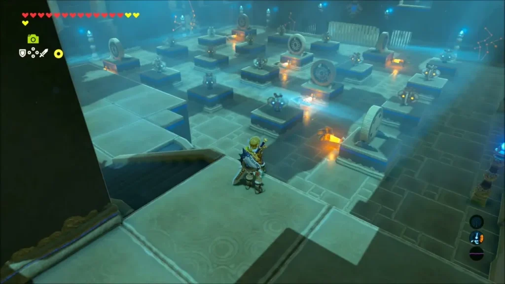 Link on a raised ledge above the shrine floor of switches and windmills Link on a raised ledge above the shrine floor of switches and windmills