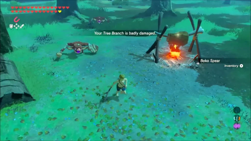 Link with a tree branch near a Bokoblin camp cooking pot over a fire Link with a tree branch near a Bokoblin camp cooking pot over a fire