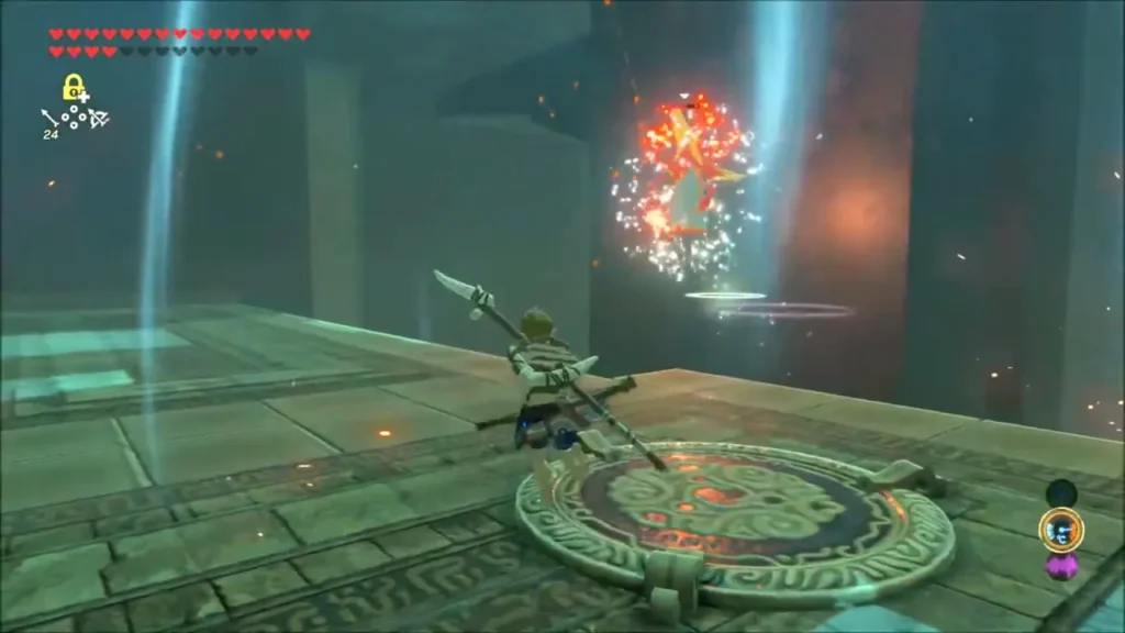 A burning rock bursts into sparks near Link in a stone arena A burning rock bursts into sparks near Link in a stone arena